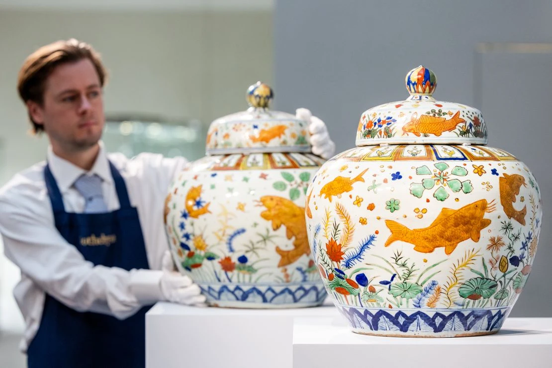 1758250312-68ccc5488d17f-an-exceptionally-rare-and-magnificent-pair-of-wucai-fish-jars-and-covers-2.webp